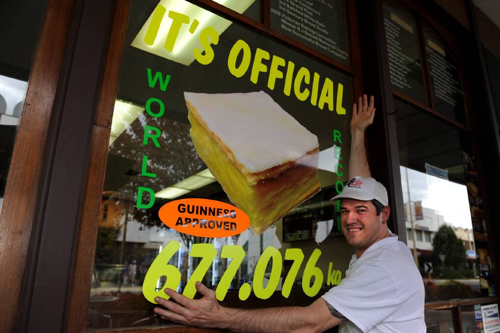 Horsham’s The Over Door Bakery baker-manager James Henwood celebrates Guinness’s tick of approval after smashing the world’s biggest vanilla slice record in October last year. Picture: SAMANTHA CAMARRI