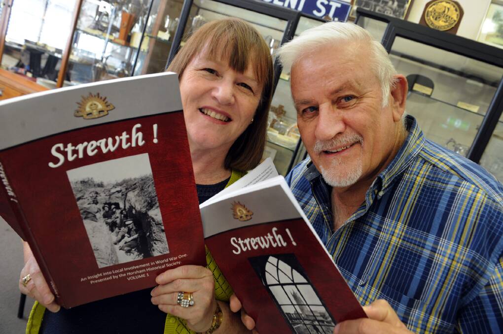 Gillian and John Francis with the two volumes of Strewth! which details Horsham's First World War effort. Picture: PAUL CARRACHER