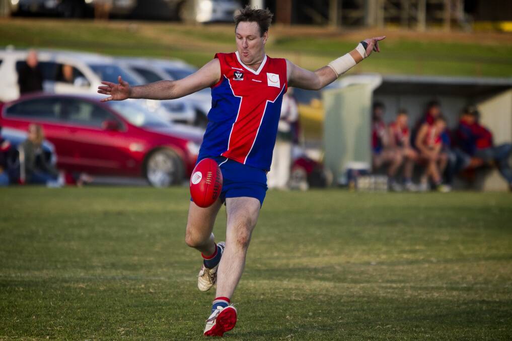 TOO GOOD: St Arnaud's Daniel Needs gets a kick away during Saturday's win over Charlton. The Saints remained on top of the ladder with the win. Picture: JASON SMITH