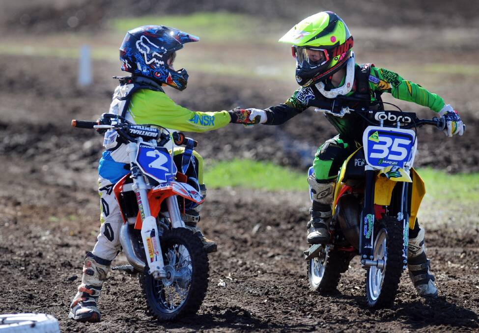 GOOD SPORT: Connor Towill, left, waited after his division 2 50cc race to shake hands with each competitor on Saturday in Dooen. Picture: Paul Carracher