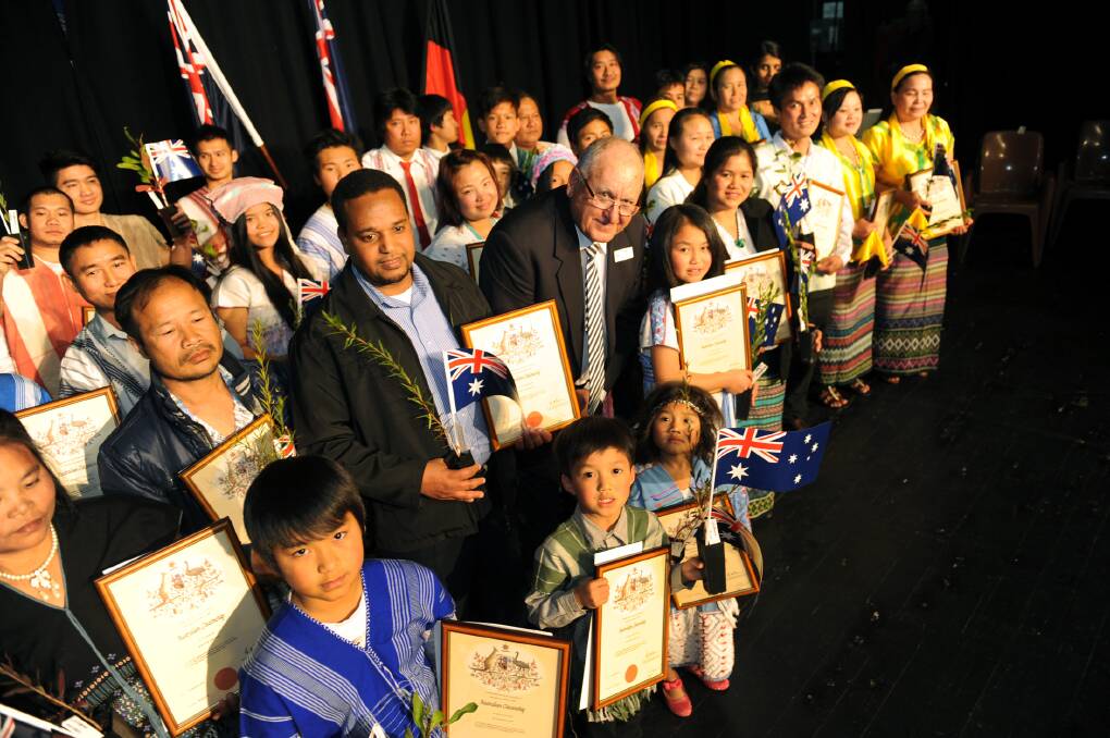 NEW CITIZENS: Hindmarsh Mayor Rob Gersch with the 35 Karen refugees naturalised at Nhill on Wednesday night. Picture: PAUL CARRACHER