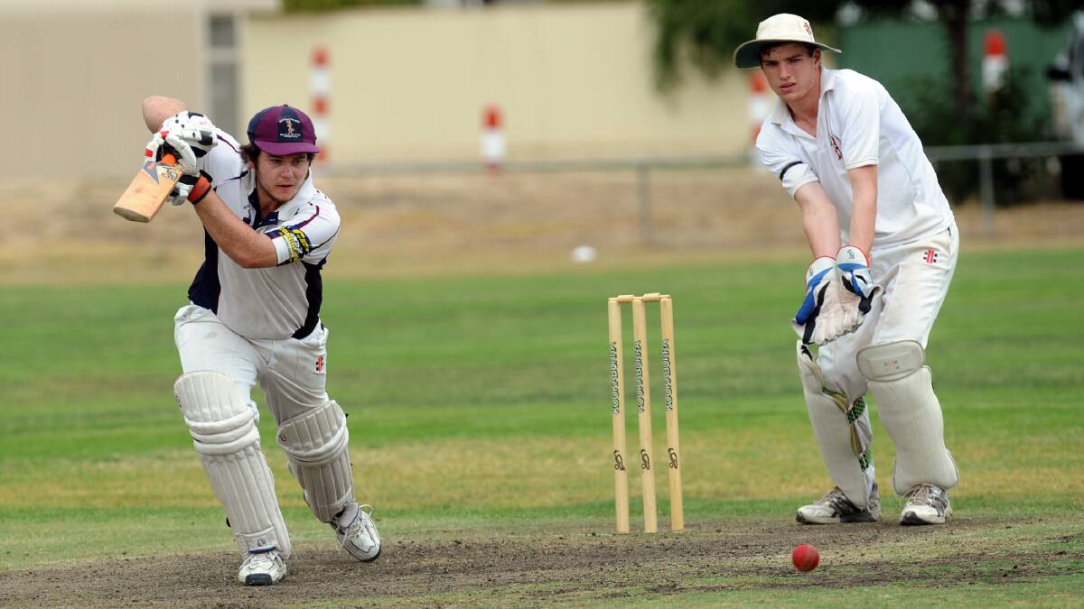 BULLANTS WIN: Bullants batsman David Combe drives through cover during his side's win against Laharum at Sunnyside, as Laharum keeper Tom Crawford looks on. Picture: PAUL CARRACHER