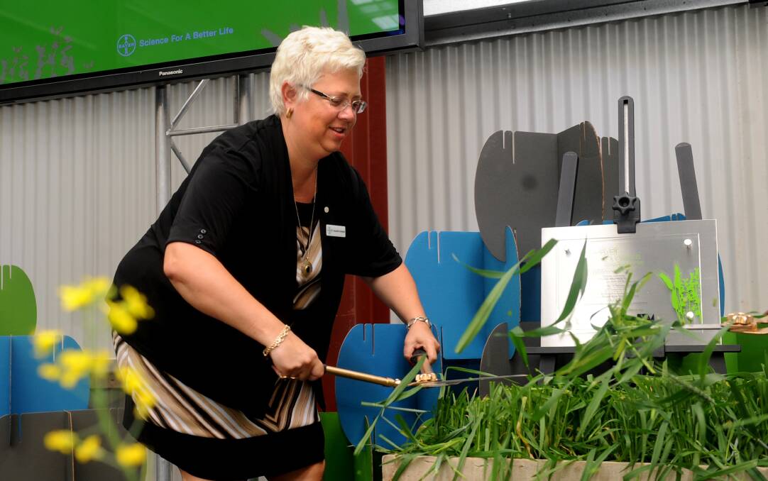OPEN FOR BUSINESS: Bayer CropScience chief executive Jacqueline Applegate unveils a commemorative plaque and officially opens the Bayer CropScience Wheet and Oilseeds breeding centre. Picture: SAMANTHA CAMARRI