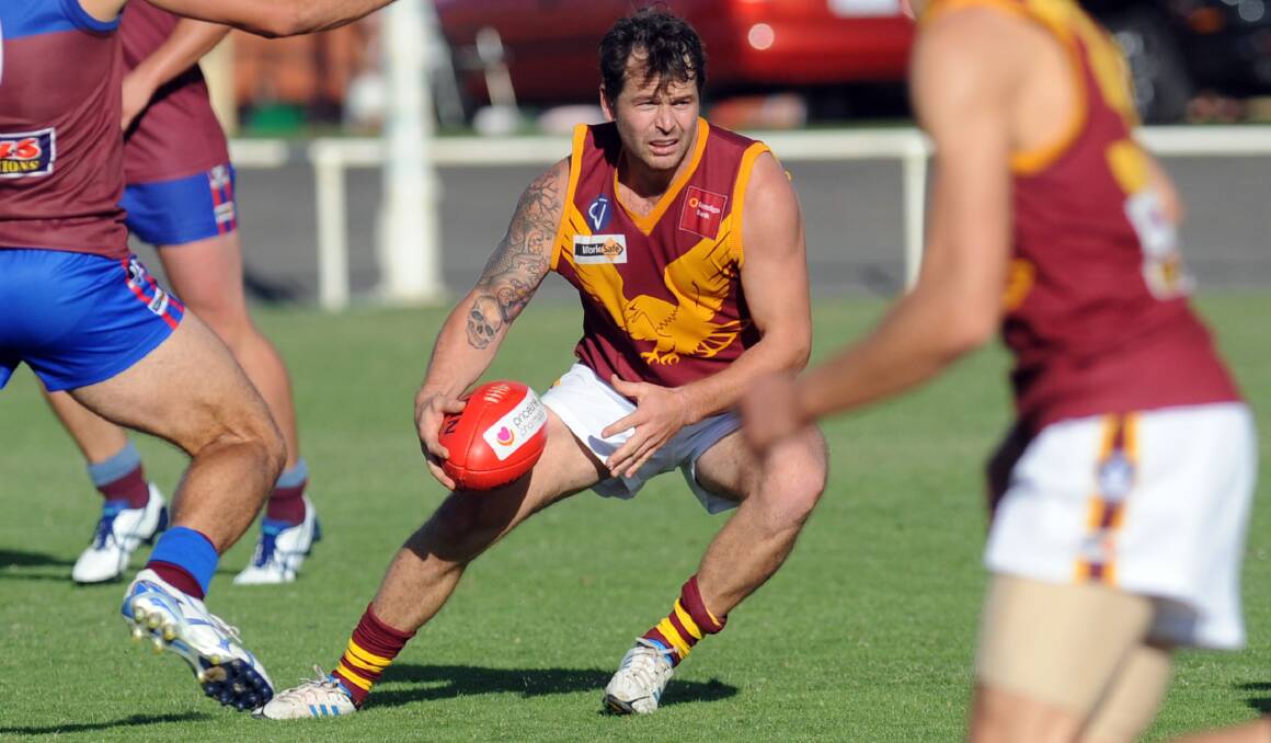 IN TRAFFIC: Warrack Eagles player and 2005 SANFL Magarey Medalllist Jeremy Clayton sizes up the situation against Horsham at Horsham City Oval. Picture: PAUL CARRACHER
