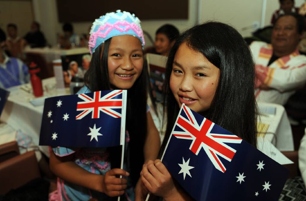 I AM AUSTRALIAN: Sarena Be Nyo and Kathria Tee Klu were among 35 Karen refugees naturalised at Nhill on Wednesday night. Picture: PAUL CARRACHER