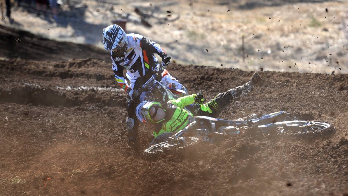 MUDDY MAYHEM: MX1 open class riders Cheyne Boyd and Jesse Dobson hit the deck on Sunday during the opening round of the MX Nationals at Dooen Reserve. Picture: SAMANTHA CAMARRI