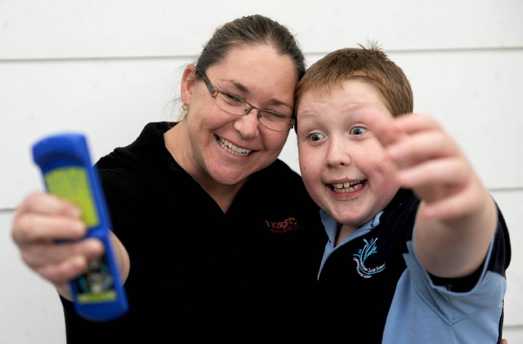 SAY CHEESE: Kirsty O'Connor of Horsham is thrilled with the effect of a cutting edge Relationship Development Intervention program on her autistic son Aidan, 10. Picture: SAMANTHA CAMARRI