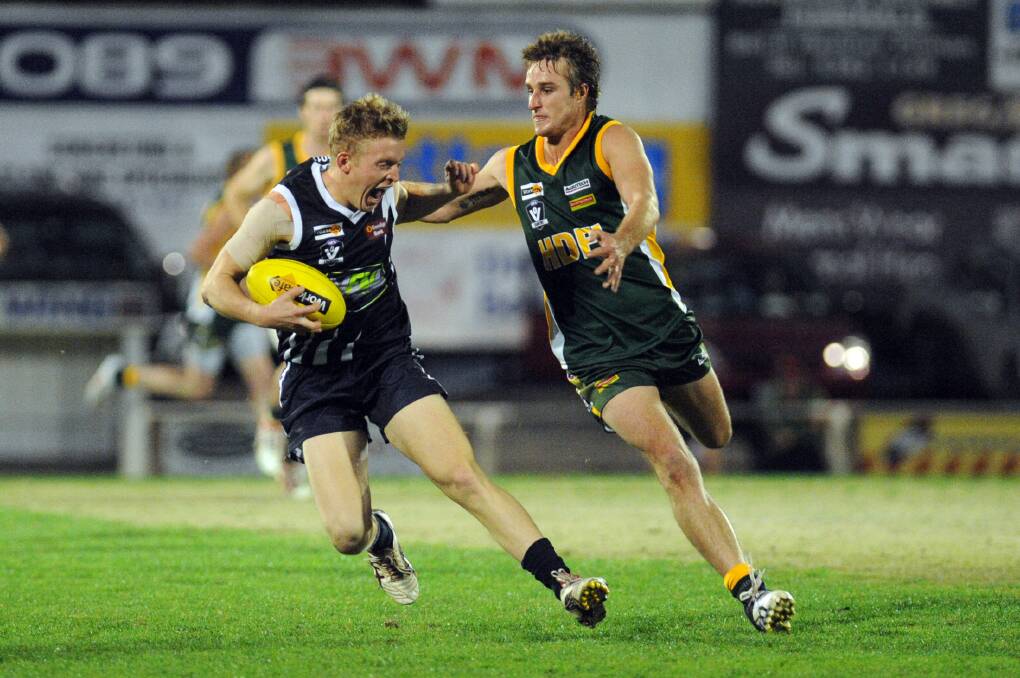 GREEN AND GOLD: Shaun McDonald, right, will add midfield depth to reigning Wimmera Football League premier Dimboola this year. McDonald is pictured playing for Horsham District Football League's interleague team in 2013. Picture: PAUL CARRACHER