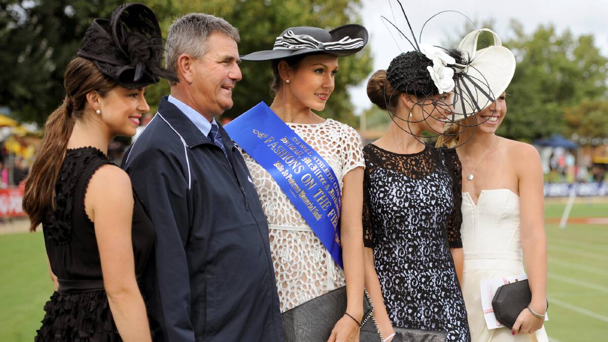 FASHION FORWARD: Driscoll McIllree and Dickinson’s Gary Driscoll with the 2013 fashions on the field winners, from left, Eleesha Nesci-Dixon, third, Cara White, first, Morgan Deane, second, and Stephanie Jinks, best hat. Ladies day organisers are expecting another hotly contested fashions on the field competition on Easter Saturday.Picture: SAMANTHA CAMARRI
