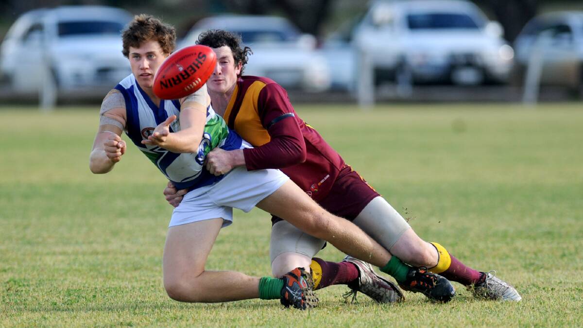 Kaniva-Leeor United's Lachlan Seed is tackled by Nathan Naylor during the Cougars' clash with Border Districts at the weekend. Picture: SAMANTHA CAMARRI