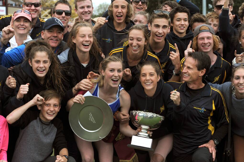 Holly Dobbyn wins the 2014 Womens Stawell Gift, celebrating with team mates. 