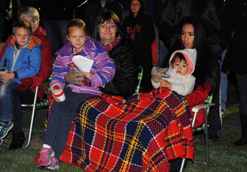 Judy Willmore, with Violet Willmore, 7, and Erika Reinhard with Malaya Willmore, 2, at Horsham Anzac Day dawn service. 