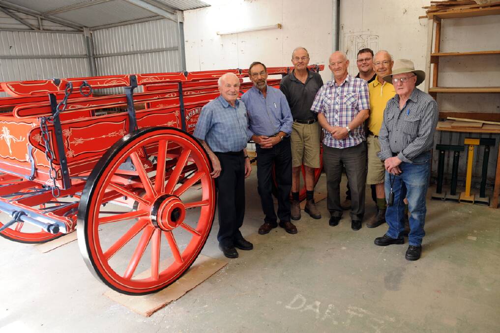 Cyril Carracher, Don Mitchell and Chas McDonald rebuilt an old May and Millar wagon.  Don Johns, Tim Batchelor, Barry Bell and Jim Heard admire the work. 