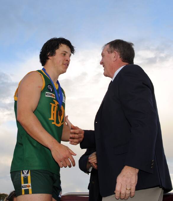 Lachie Exell with Hugh Delahunty. after Dimboola won the 2013 WFL premiership.