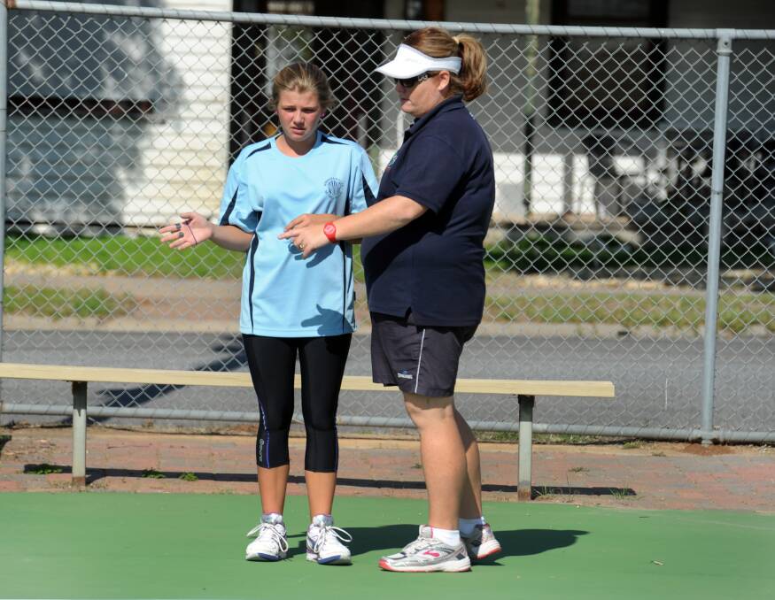 Umpire coach Leah Saunders gives Imogen Amos, St Arnaud, tips at netball training camp at Donald. 