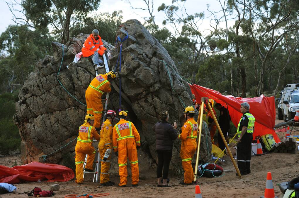 ACTION: Dramatic rescue unfolds at Mt Arapiles. A Man, 24, trapped while negotiating the Mt Arapiles Squeeze Test. Pictures: PAUL CARRACHER