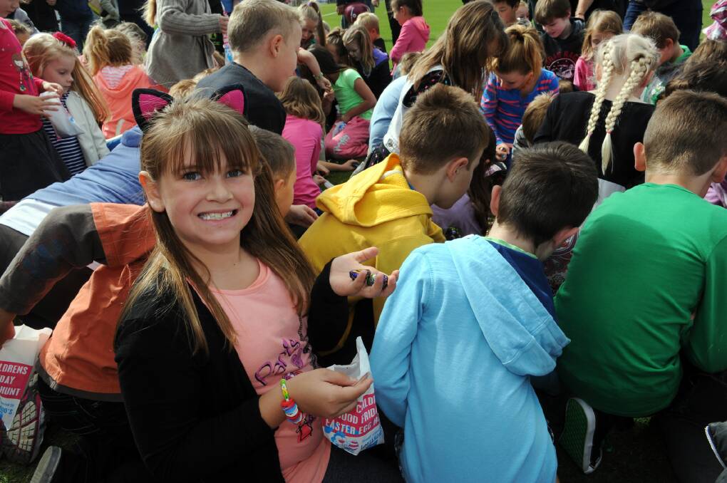 Indilly Penny, 7, happy with her collection at Bendigo Bank Good Friday Easter Egg HUnt at Horsham City Oval. 