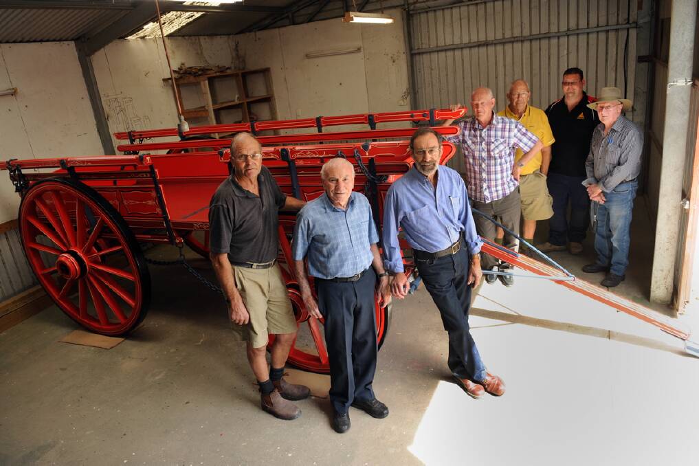 Chas McDonald, Cyril Carracher and Don Mitchell rebuilt an old May and Millar wagon.  Don Johns, Barry Bell, Tim Batchelor and Jim Heard admire the work. 