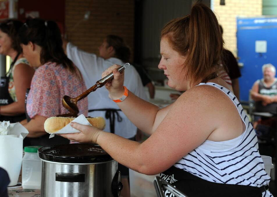 WORKING HARD: Amy Craig of Apsley serves food at the Lake Charlegrark Country Music Marathon.