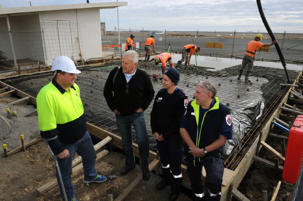 COMMUNITY PROJECT: Chris Jorgensen, Philip Nicks, Anna Brown and Maurice Ellis at the site of new Horsham Aeromedical Transfer Station at Horsham Aerodrome. Works began on the transfer station this week. Picture: PAUL CARRACHER