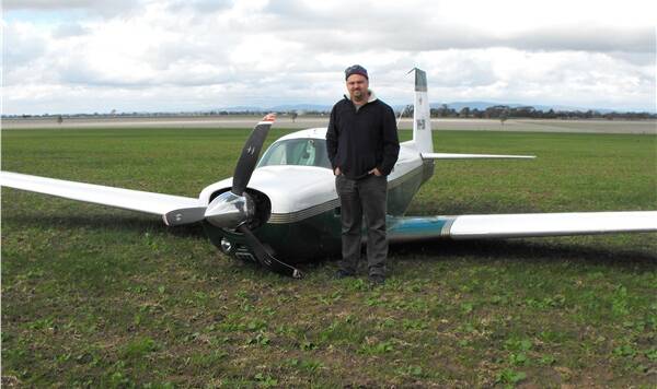 LUCKY: Rockhampton pilot Karlis Guglis with his crashed plane. Picture: KAYLENE MAILES