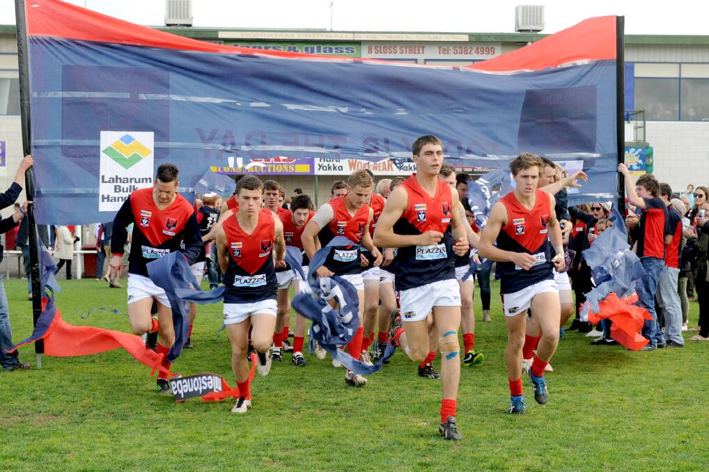 GRAND FINAL MEMORIES: Reigning premier Laharum runs onto the ground for last year's grand final at Horsham City Oval. The HDFNL has named the venues for the 2014 finals series. Picture: PAUL CARRACHER