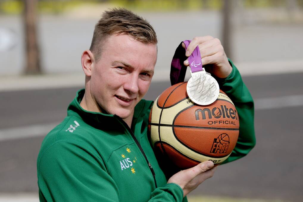 REDEMPTION: Jannik Blair with the silver medal he won with the national men's wheelchair basketball team at the 2012 London Paralympics. Blair and the Rollers went one better today when they beat USA in the gold medal game of the world championships. Picture: SAMANTHA CAMARRI