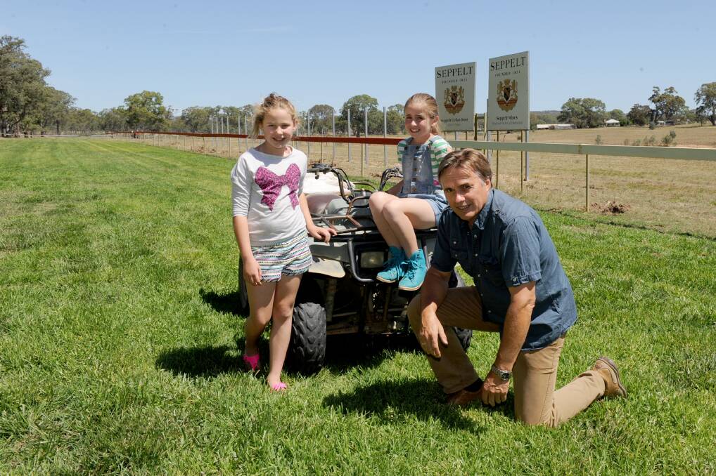 READY: Great Western Racing Club secretary Michael Barry, with Tiarna Barry, 10, and Leigha Lehmann, 10, have helped prepare the Great Western Racecourse for the Seppelt Salinga Great Western Cup on Sunday. Picture: SAMANTHA CAMARRI