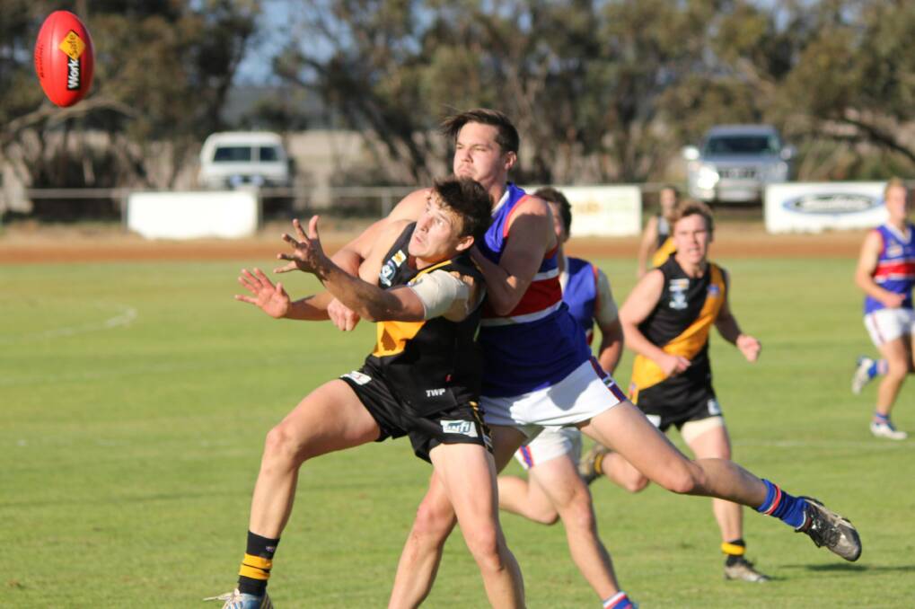 GRAND FINAL BOUND: Sea Lake-Nandaly Tigers' Simon Weekly, front, fights for a mark with Jeparit-Rainbow's Wyatt Bacon earlier in the year. Weekly kicked a crucial goal for the Tigers in Saturday's second semi-final win against Beulah. Picture: CONTRIBUTED
