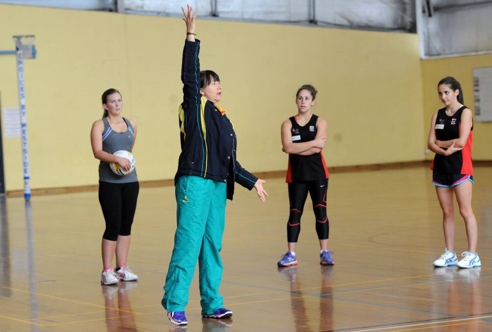EXPERT ADVICE: Australian Diamonds netball coach Lisa Alexander takes a training clinic with Wimmera players to launch the 2014 Wimmera Netball Association season. Picture: SAMANTHA CAMARRI