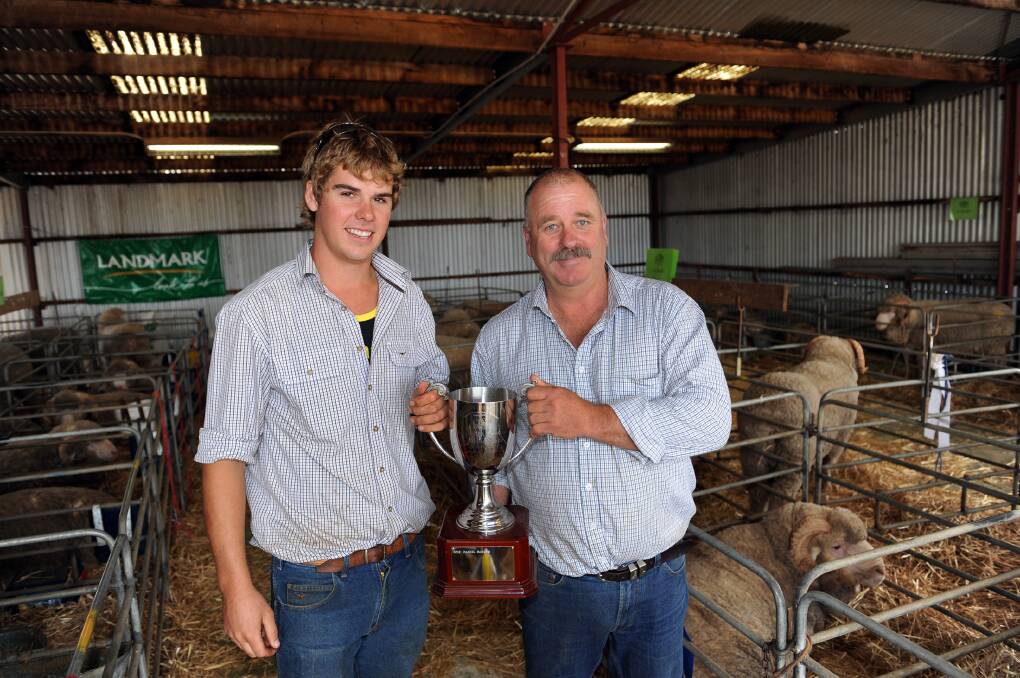 TOP PRODUCER: The Royal Agricultural Society of Victoria has named Telangatuk East farmer Daniel Rogers Australian Young Sheep Breeder of the Year. Mr Rogers, left, is pictured with judge Kevin Beaton at the Balmoral Show last year, where he won the junior sheep judging competition. Picture: PAUL CARRACHER