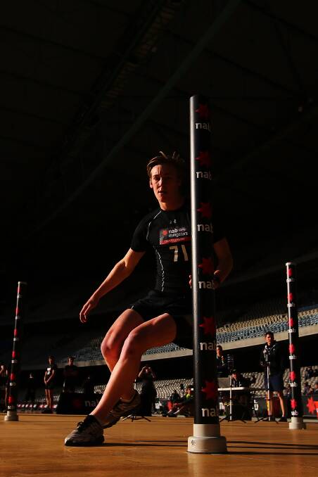 ON THE WAY: Edenhope's Oscar McDonald weaves through poles in an agility test at the AFL draft combine in Melbourne. McDonald believes he has increased his chances of being picked up in next month's AFL national draft after a good performance at the combine. Picture: GETTY IMAGES