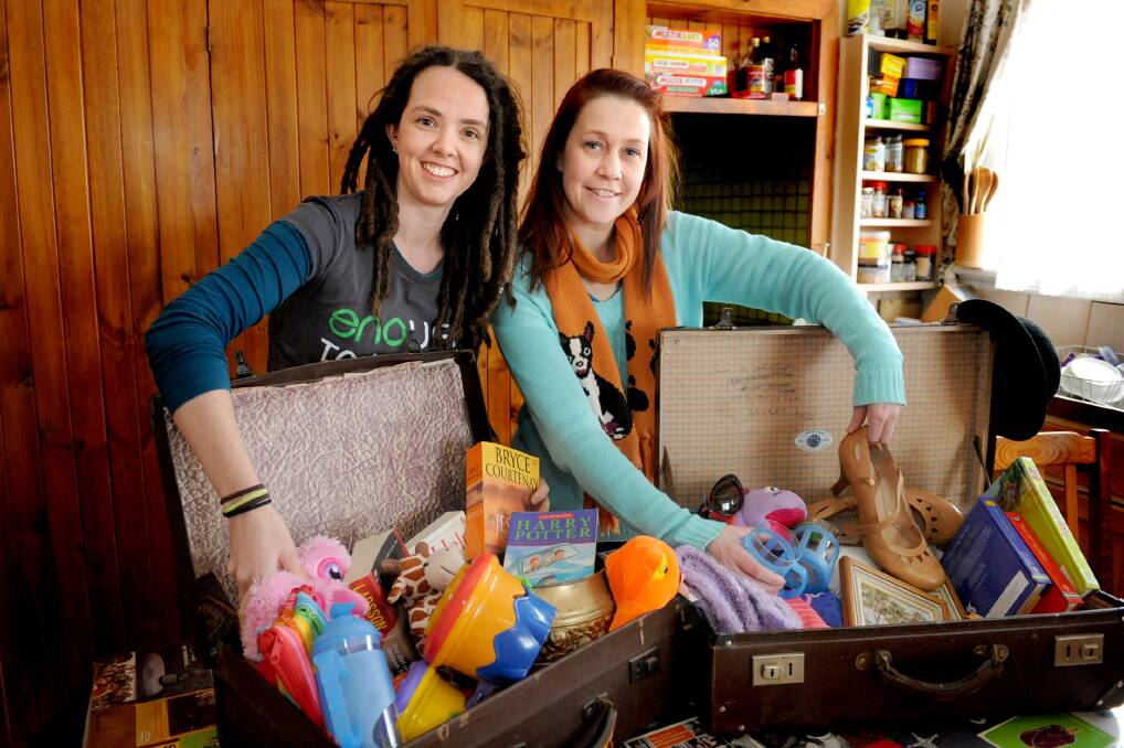 HELPING HAND: Horsham mothers Alison Briggs-Miller and Larissa Riddell have arranged a suitcase rummage to take a stand against the Federal Government's treatment of asylum seekers. Picture: SAMANTHA CAMARRI