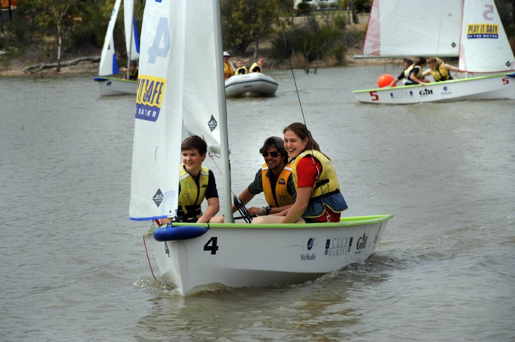 SAILING AWAY: Yachting Victoria's James Gibson, middle, takes Horsham College students Jake Edgerton and Megan Shaw for a ride in the Wimmera River last week. Yachting Victoria hosted a come and try clinic for students in conjunction with the Wimmera Regional Sports Assembly and the Horsham Yacht Club. Picture: PAUL CARRACHER