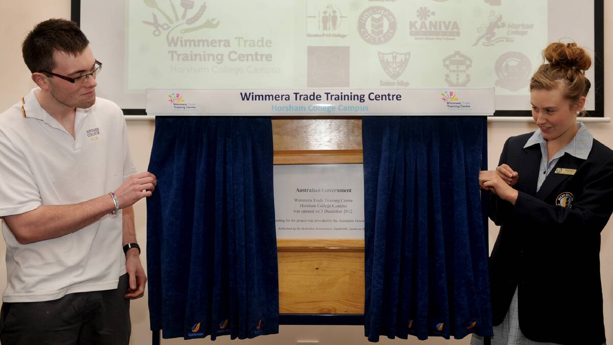 ON THE JOB: Wimmera secondary student representatives Callum Burns and Ashleigh Dwyer opening the Horsham College-based Wimmera
Trade Training Centre site in 2012. Pictures: SAMANTHA CAMARRI
