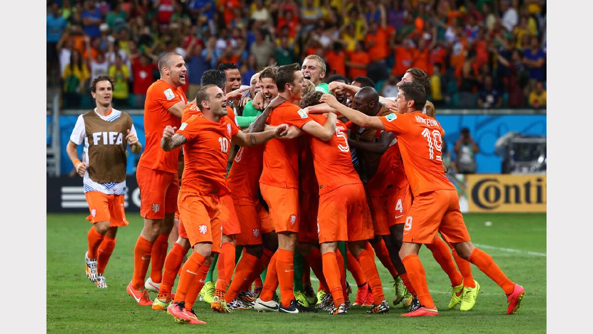 The Netherlands celebrate their penalty shoot-out win over Costa Rica. Photos: Getty Images.