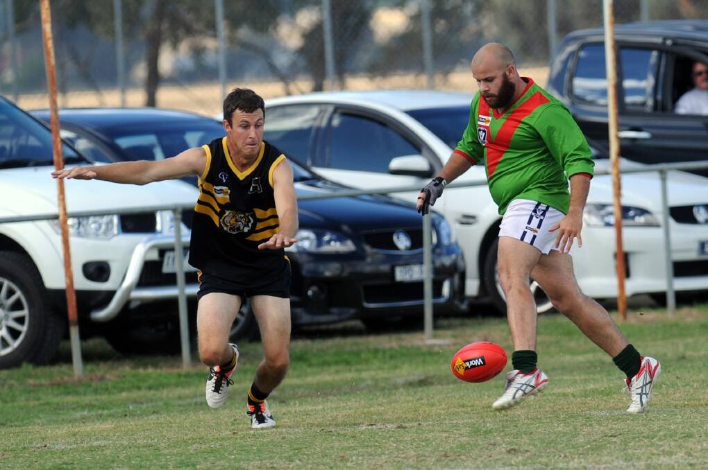 SHARP SHOOTER: Noradjuha-Quantong's Brian Harrison, right, kicked five goals against Rupanyup. Picture: PAUL CARRACHER