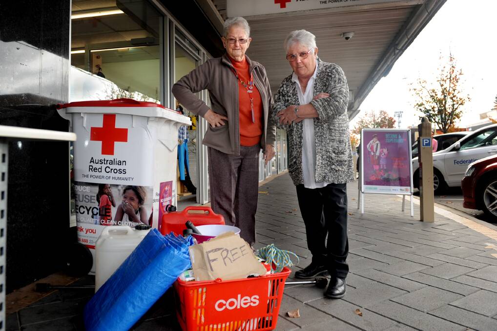 Horsham Red Cross Shop supervisor Di Johnson and manager Lynne Eckersley were shocked to find rubbish dumped at the front of their Firebrace Street store with a ‘free’ sign last week. Picture: SAMANTHA CAMARRI