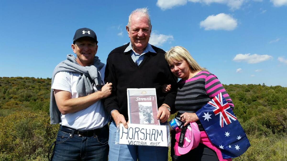 Graham Hutchinson, centre, his son Bryce and daughter-in-law Nicci at the site of the trench Robert 'Bob' Hutchinson was photographed in during the Anzacs' Gallipoli campaign 100 years ago. Picture: CONTRIBUTED
