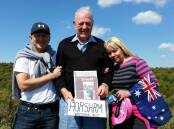 Graham Hutchinson, centre, his son Bryce and daughter-in-law Nicci at the site of the trench Robert 'Bob' Hutchinson was photographed in during the Anzacs' Gallipoli campaign 100 years ago. Picture: CONTRIBUTED