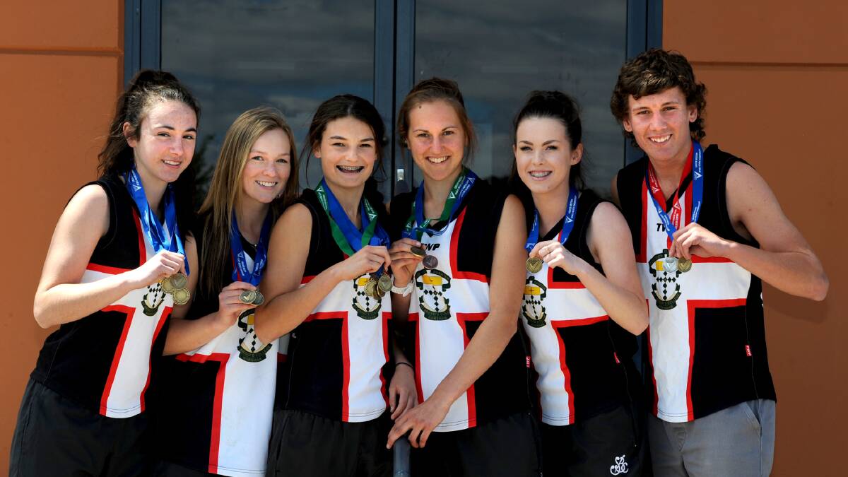 HIGH ACHIEVERS: Horsham's Anna Bush, left, and Tara Jasper, third from left, competed at the Athletics Victoria 2015 Victorian Country Championships in Bendigo. Picture: SAMANTHA CAMARR