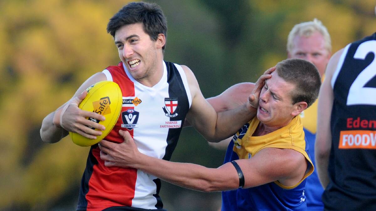 STRUGGLE: Edenhope-Apsley's Ben Chadwick tries to break away from Natimuk United's Callum Cameron in a match earlier this year. Picture: SAMANTHA CAMARRI