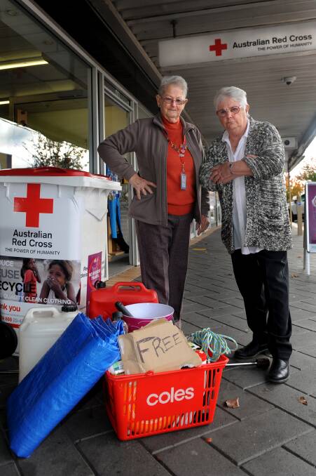 Horsham Red Cross Shop supervisor Di Johnson and manager Lynne Eckersley were shocked to find rubbish dumped at the front of their Firebrace Street store with a ‘free’ sign last week. Picture: SAMANTHA CAMARRI 