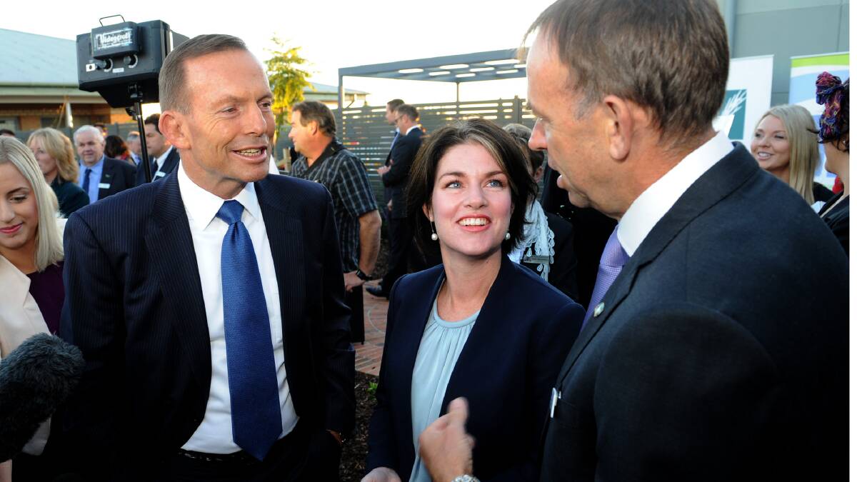 Member for Lowan Emma Kealy, with Prime Minister Tony Abbott and Wimmera Health Care Group chief executive Chris Scott when Mr Abbott announced $1 million for the Wimmera Cancer Centre in March. Ms Kealy has called on the state government to match the funding in its budget tomorrow. Picture: PAUL CARRACHER