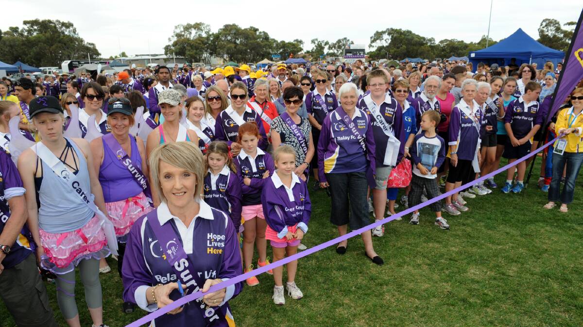 HOPE: Horsham cancer survivor Jenny Clayton cuts a ribbon to mark the start of the Horsham and District Relay for Life on Friday. Picture: PAUL CARRACHER