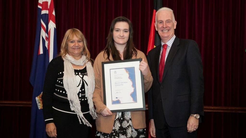 HIGH ACHIEVER: Victorian Aboriginal Education Association president Geraldine Atkinson and Minister for Education Martin Dixon present Horsham College student Jess Fogwell with a Wannik Education Scholarship. Picture: CONTRIBUTED