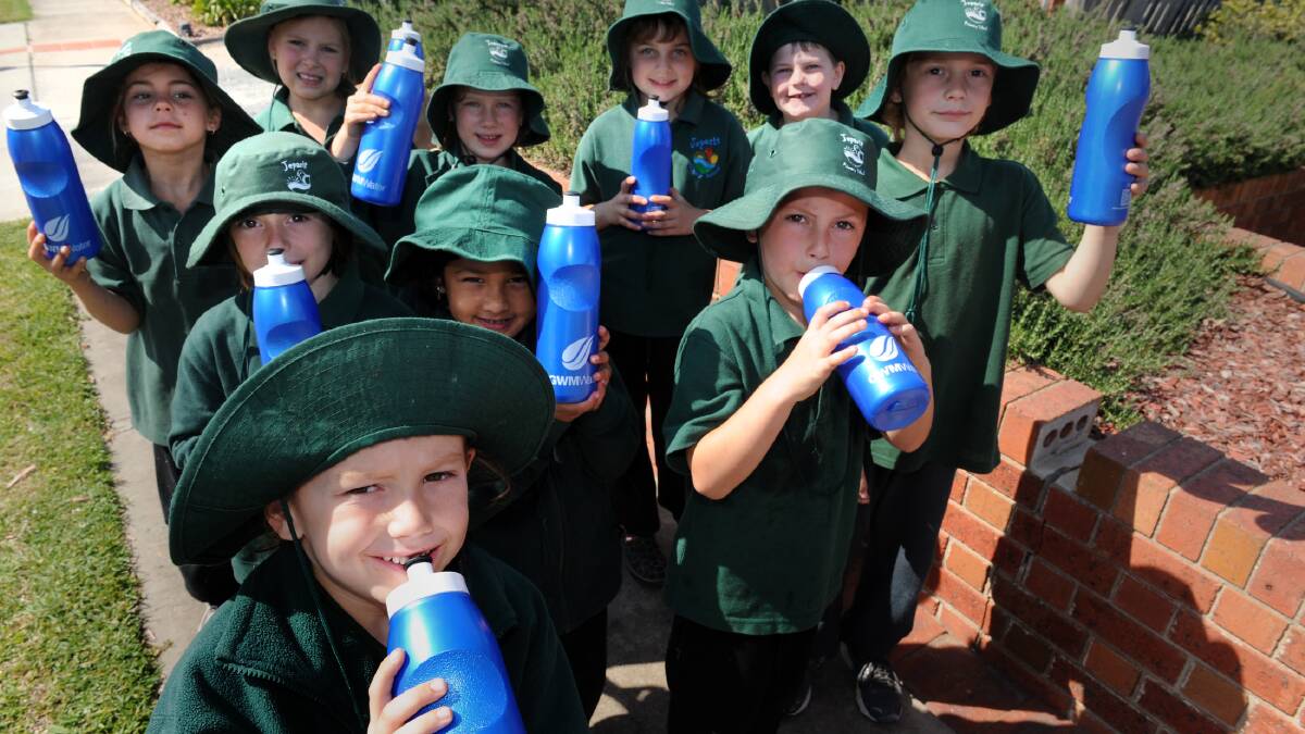 CLEAN WATER: Jeparit Primary School student Kayden Stonehouse, 5, and classmates enjoy a fresh drink of water at Jeparit after improvements to the town’s water supply. Member for Lowan Hugh Delahuny was in Jeparit on Tuesday to celebrate and also announce a Menzies Square development. Picture: PAUL CARRACHER
