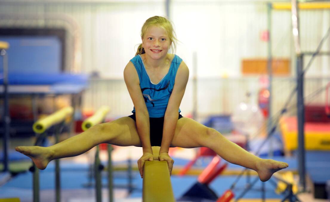 POISE: Kayla Kelm practises on the balance beam ahead of Natimuk and District Gymnastic Club’s annual invitational competition, which starts on Saturday. Picture: PAUL CARRACHER