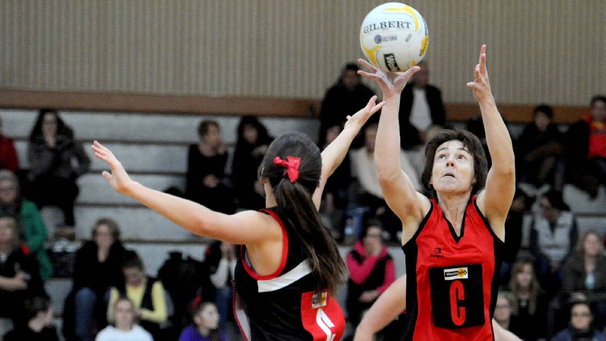 CONTESTED BALL: Stawell B Grade centre Jodie Hendy looks to accept an incoming pass as her Horsham Saints opponent Katelyn Ticchi tries to intercept. Both Hendy and Ticchi were named among their sides’ best players at the weekend. Picture: SAMANTHA CAMARRI