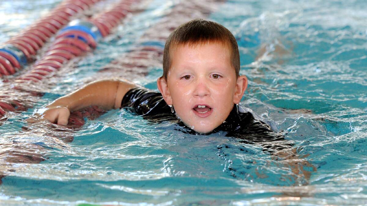Horsham Special School student Jayden Madex at Horsham Aquatic Centre's swimathon. Picture: SAMANTHA CAMARRI
